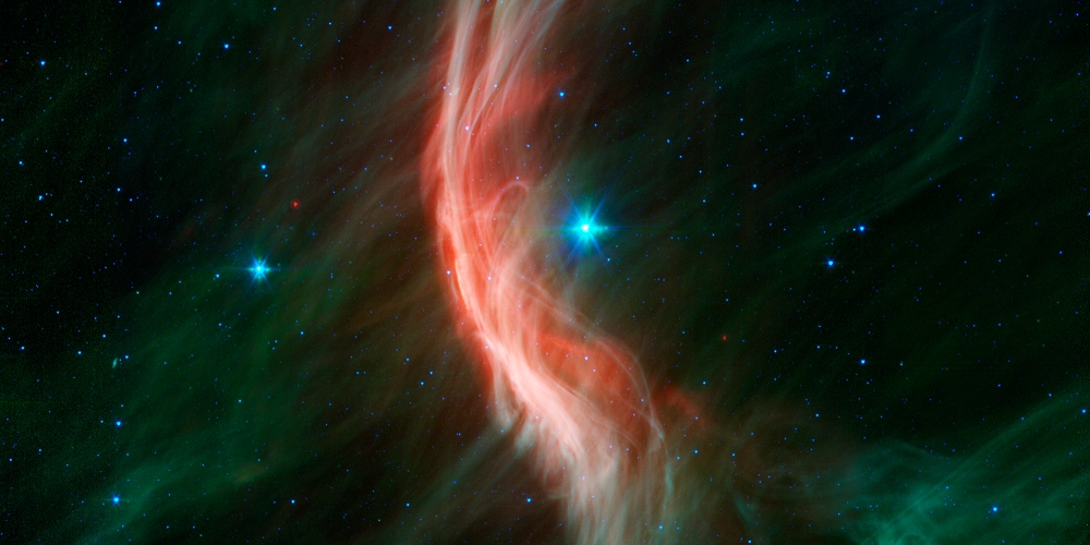  Dit infrarood beeld toont de wegloopster Zeta Ophiuchi waarbij het een schokgolf veroorzaakt in de interstellaire stofwolk.